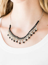 Load image into Gallery viewer, Infused with silver chain, shiny black beads are threaded along an invisible wire below the collar. Matching black beads and glittery white rhinestones swing from the pearly strand, creating a flirtatious fringe below the collar. Features an adjustable clasp closure.  Sold as one individual necklace. Includes one pair of matching earrings.