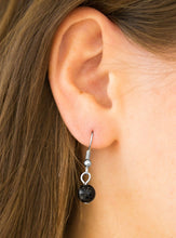 Load image into Gallery viewer, Shimmery silver heart charms, silver beads, and polished black beads swing from a row of matching black beads, creating a whimsical fringe below the collar. Featuring a regal teardrop shape, a glittery white rhinestone swings from the center for a refined finish. Features an adjustable clasp closure.  Sold as one individual necklace. Includes one pair of matching earrings.