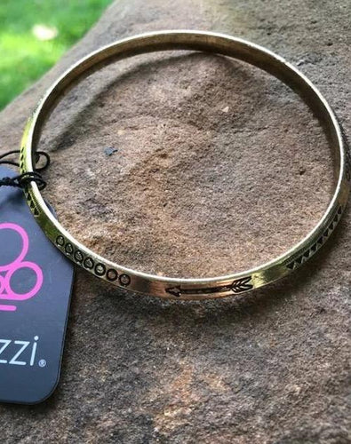 Stamped in geometric and arrow patterns, an antiqued brass bangle slides along the wrist for a tribal inspired look.  Sold as one individual bracelet.  Always nickel and lead free.  Exclusive