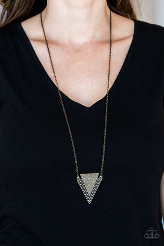 Stamped and studded in indigenous inspired textures, a stacked triangular pendant swings from the bottom of an elongated brass chain for a trendy tribal look. Features an adjustable clasp closure.  Sold as one individual necklace. Includes one pair of matching earrings.  Always nickel and lead free.