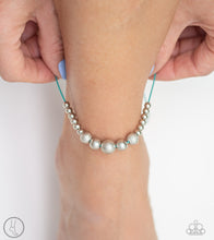 Load image into Gallery viewer, A collection of dainty silver and hammered silver beads slide along a shiny turquoise cord around the ankle for a whimsical look. Features an adjustable sliding knot closure.  Sold as one individual anklet.  Always nickel and lead free.