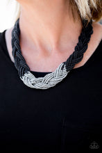Load image into Gallery viewer, Strands of black seed beads create an indigenous braid below the collar. The black seed beads gradually morph into metallic silver beads at the center for a chic contrasting look. Features an adjustable clasp closure.  Sold as one individual necklace. Includes one pair of matching earrings.  Always nickel and lead free