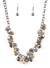 Load image into Gallery viewer, Necklace and Earrings:  Featuring shiny, faceted, and mesh finishes, mismatched copper, gold, and gunmetal beads trickle below the collar for an edgy industrial look. Features an adjustable clasp closure.  Bracelet:  Featuring shiny, faceted, and mesh finishes, mismatched copper, gold, and gunmetal beads trickle from the wrist for an edgy industrial look. Features an adjustable clasp closure.  Sold as one individual necklace, earrings, and bracelet.