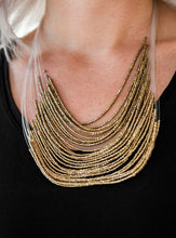 Load image into Gallery viewer, Strand after strand of shimmering brass seed beads fall together to create a bold statement piece. Features an adjustable clasp closure.  Sold as one individual necklace. Includes one pair of matching earrings.