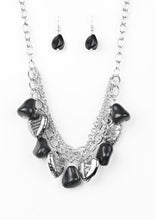 Load image into Gallery viewer, Black faux rocks alternate with heart charms along a chunky silver chain. Hearts are inscribed with the phrase "With All My Heart" on one side and a short bible verse on the other that reads, "Love the Lord thy God with all your heart. Luke 10:27." Layers of various chains add some edge. Features an adjustable clasp closure.  Sold as one individual necklace. Includes one pair of matching earrings.