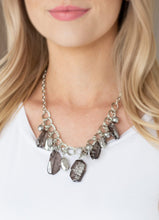 Load image into Gallery viewer, Streaked in metallic accents, faceted smoky beads swing from the bottom of a doubled-linked silver chain below the collar. Shiny silver beads and asymmetrical accents trickle between the colorful beads, adding a flashy finish to the colorful fringe. Features an adjustable clasp closure.  Sold as one individual necklace. Includes one pair of matching earrings. Always nickel and lead free.
