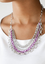 Load image into Gallery viewer, Mismatched silver chains layer below the collar for a bold industrial look. Painted in a colorful finish, a shiny purple chain drapes between the shimmery silver chains for a vivacious finish. Features an adjustable clasp closure.  Sold as one individual necklace. Includes one pair of matching earrings.