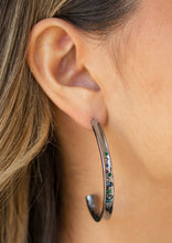 Load image into Gallery viewer, Featuring a concaved surface, a glistening gunmetal ribbon is encrusted in a section of glassy blue, green, purple, and hematite rhinestones as it curves into a half-hoop. Earring attaches to a standard post fitting. Hoop measures approximately 1 1/4&quot; in diameter.  Sold as one pair of hoop earrings.  