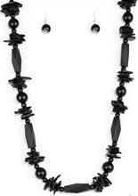 Load image into Gallery viewer, Featuring round, faceted, and distressed finishes, mismatched black wooden beads are threaded along shiny black cording for a summery look. Features an adjustable sliding knot closure.   Sold as one individual necklace. Includes one pair of matching earrings.  Always nickel and lead free.