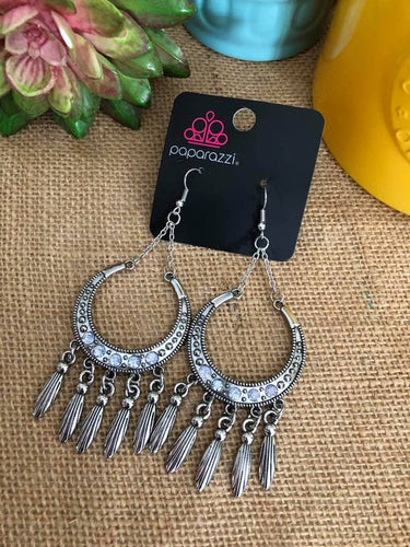A crescent moon shape with dainty baby blue rhinestones adjourning the bottom half of the moon. Shimmering silver tassels add just the right flair.  Sold as one pair of earrings.