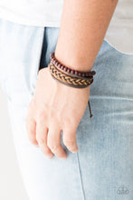 Load image into Gallery viewer, Mismatched strands of brown twine, brown leather, and earthy wooden beads layer across the wrist for a nautical inspired look. Features an adjustable sliding knot closure.  Sold as one individual bracelet.  Always nickel and lead free.