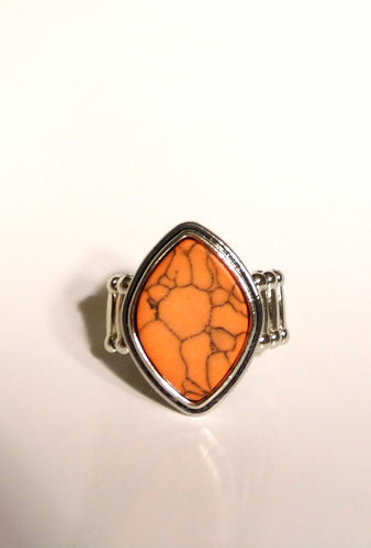 An asymmetrical slab of orange stone is pressed into the center of a stacked silver frame, creating a seasonal centerpiece atop the finger. Features a stretchy band for a flexible fit.  Sold as one individual ring.  Always nickel and lead free.  Fashion Fix March 2021 Exclusive