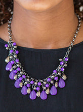 Load image into Gallery viewer, Glistening gunmetal and vivacious purple teardrops drip from the bottom of interlocking gunmetal chains. Matching gunmetal and purple beads trickle down the rows of chain, creating a bold fringe below the collar. Features an adjustable clasp closure.  Sold as one individual necklace. Includes one pair of matching earrings.