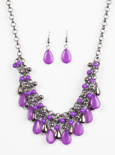 Load image into Gallery viewer, Glistening gunmetal and vivacious purple teardrops drip from the bottom of interlocking gunmetal chains. Matching gunmetal and purple beads trickle down the rows of chain, creating a bold fringe below the collar. Features an adjustable clasp closure.  Sold as one individual necklace. Includes one pair of matching earrings.