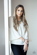 Load image into Gallery viewer, Necklace and Earrings:  A glittery collection of sparkling white rhinestones, faceted silver beads, and blue crystal-like beads dangle from a shimmery silver chain, creating a refined fringe below the collar. Features an adjustable clasp closure.  Bracelet:  A glittery collection of sparkling white rhinestones, faceted silver beads, and blue crystal-like beads dangle from the wrist, creating a refined fringe. Features an adjustable clasp closure.