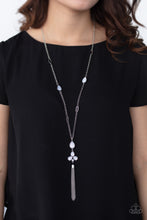 Load image into Gallery viewer, A cluster of dewy white teardrop beads coalesces at the bottom of a lengthened silver chain. Matching beads embedded in airy silver frames dot the chains that climb the chest, bringing an extra pop of color to the whimsical design. A glistening silver tassel cascades from the bottom of the colorful pendant, creating ethereal movement. Features an adjustable clasp closure.  Sold as one individual necklace. Includes one pair of matching earrings.  Always nickel and lead free.