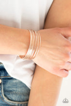 Load image into Gallery viewer, Attached to two rose gold rods, smooth and textured rose gold bars curl around the wrist, creating the illusion of stacked bangles. Sold as one individual bracelet.  Complete the look with other pieces from the collection  Always nickel and lead free.