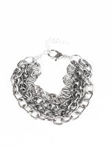Load image into Gallery viewer, Four strands of bold gunmetal and silver chain layer across the wrist for an edgy look. Features an adjustable clasp closure.  Sold as one individual bracelet.