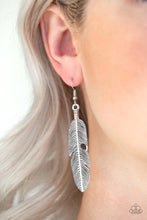Load image into Gallery viewer, Brushed in an antiqued shimmer, a lifelike silver feather frame swings from the ear in a seasonal fashion. Earring attaches to a standard fishhook fitting.  Sold as one pair of earrings.  Always nickel and lead free.