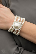 Load image into Gallery viewer, Threaded along stretchy bands, four strands of pearly white beads are held in place by an exaggerated pearl bead encased in a frame of glassy white rhinestones for a vintage-inspired finish.