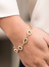 Load image into Gallery viewer, A combination of teardrop and round frames encrusted in white rhinestones link together and delicately mingle around the wrist. The subtle tone-on-tone approach adds dimension and a vintage flair. Features an adjustable clasp closure.