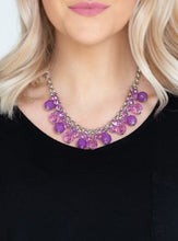 Load image into Gallery viewer,   A collection of glassy and opaque purple crystal-like beads swing from the bottom of interlocking silver chains, creating a fabulous fringe below the collar. Features an adjustable clasp closure.  Sold as one individual necklace. Includes one pair of matching earrings. 