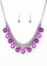 Load image into Gallery viewer, A collection of glassy and opaque purple crystal-like beads swing from the bottom of interlocking silver chains, creating a fabulous fringe below the collar. Features an adjustable clasp closure.  Sold as one individual necklace. Includes one pair of matching earrings.