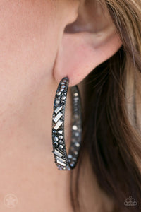 The front facing surface of a chunky gunmetal hoop is dipped in brilliantly sparkling rhinestones while light-catching texture wraps around the back. The interior of the hoop features the opposite pattern, creating the illusion of a full hoop of blinding rhinestones. Earring attaches to a standard post fitting. Hoop measures 1 3/4" in diameter.  Sold as one pair of earrings.   Always nickel and lead free.  Blockbuster!!
