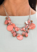 Load image into Gallery viewer, What better way to say "hello spring" than with this vibrant stunner? Double the fun with two layers of beads, baubles, stone, and wood in varying tones and finishes in the Pantone® of Burnt Coral, intermixed with sparkling, wavy silver discs gently swaying from a silver chain. Features an adjustable clasp closure.