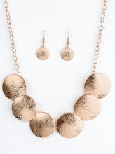 Load image into Gallery viewer, Embossed in shimmery linear patterns, round rose gold frames link below the collar for a bold industrial look. Features an adjustable clasp closure.  Sold as one individual necklace. Includes one pair of matching earrings.