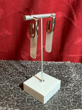 Load image into Gallery viewer, Featuring a faux marble finish, a colorful acrylic frame attaches to the bottom of a dainty silver hoop for a retro inspired look. Earring attaches to a standard post fitting. Hoop measures approximately 1/2" in diameter.  Featured inside The Preview at ONE Life!   Sold as one pair of hoop earrings.  New Kit    Always nickel and lead free.