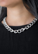 Load image into Gallery viewer, Brushed in a high-sheen shimmer, a bold silver chain drapes below the collar in an edgy industrial fashion. Features an adjustable clasp closure.  Sold as one individual necklace. Includes one pair of matching earrings.