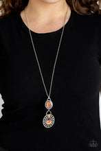 Load image into Gallery viewer, Dotted with glowing orange cat's eye accents, two dizzying silver frames swing at the bottom of a lengthened silver chain. The stacked pendants swirl with studded patterns and vine-like filigree for a seasonal flair. Features an adjustable clasp closure.  Sold as one individual necklace. Includes one pair of matching earrings.  Always nickel and lead free.