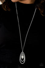 Load image into Gallery viewer, Dotted in sections of studded textures, three glistening silver teardrops swing from the bottom of an elongated silver chain. Featuring a regal marquise style cut, a glittery white gem is pressed into the centermost frame for a glamorous finish. Features an adjustable clasp closure.  Sold as one individual necklace. Includes one pair of matching earrings.  Always nickel and lead free.