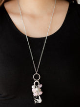 Load image into Gallery viewer, A silver bird charm, silver heart charms, and collection of white pearls and opaque pink crystal-like beads swing from the bottom of a lengthened silver chain for a whimsically clustered look. Features an adjustable clasp closure.  Sold as one individual necklace. Includes one pair of matching earrings.