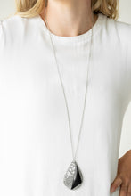 Load image into Gallery viewer, Featuring a triangular shape, a shiny black bead is pressed into a hammered silver teardrop radiating with airy cut-out patterns for an edgy look. The impressive pendant swings from the bottom of a lengthened silver chain for an edgy finish. Features an adjustable clasp closure.  Sold as one individual necklace. Includes one pair of matching earrings.   Always nickel and lead free.