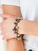 Load image into Gallery viewer, Necklace and Earrings:  Featuring shiny, faceted, and mesh finishes, mismatched copper, gold, and gunmetal beads trickle below the collar for an edgy industrial look. Features an adjustable clasp closure.  Bracelet:  Featuring shiny, faceted, and mesh finishes, mismatched copper, gold, and gunmetal beads trickle from the wrist for an edgy industrial look. Features an adjustable clasp closure.  Sold as one individual necklace, earrings, and bracelet.
