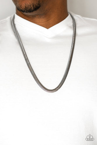 Featuring a high-sheen finish, a thick gunmetal herringbone chain drapes across the chest for a sleek, upscale look. Features an adjustable clasp closure.  Sold as one individual necklace.  Always nickel and lead free.