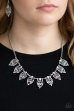 Load image into Gallery viewer, Swirling with dotted filigree, dainty silver leaf frames swing from the bottom of a glistening silver chain, creating a whimsical fringe below the collar. Features an adjustable clasp closure.  Sold as one individual necklace. Includes one pair of matching earrings.  Always nickel and lead free.