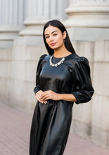 Load image into Gallery viewer, An oversized collection of white emerald cut gems and regally cut clusters of rhinestones delicately link below the collar, creating a dramatically sparkly fringe. Features an adjustable clasp closure.  Sold as one individual necklace. Includes one pair of matching earrings.  Always nickel and lead free.