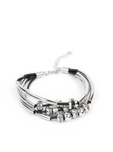 Load image into Gallery viewer, Multiple strands of black cord are fitted with long, curved cylinders that meet in the middle. The sliding bars are separated by small antiqued silver loops that mimic pipe fittings, making this a perfect addition to any industrial look. Features an adjustable clasp closure.