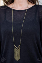 Load image into Gallery viewer, Encrusted in aurum rhinestones, a V-shaped frame attaches to an airy brass frame, creating a stacked pendant. Swinging from the bottom of a lengthened brass chain, the glamorous pendant gives way to a tapered fringe for a fierce finish. Features an adjustable clasp closure.  Sold as one individual necklace. Includes one pair of matching earrings.    Magnificent Musings Fashion Fix  August 2018  Always nickel and lead free.