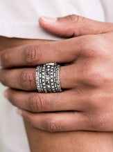 Load image into Gallery viewer, Layers of linear silver texture are accented with a single row of hematite rhinestones, adding a touch of glam to the gritty design. Features a stretchy band for a flexible fit.