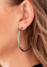 Load image into Gallery viewer,  A band of chiseled, gritty silver chain links is bordered by sleek silver bars and shaped into a hoop that curls boldly around the ear. Earring attaches to a standard post fitting. Hoop measure approximately 2" in diameter.