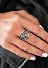 Load image into Gallery viewer, Stamped in ropelike patterns, glistening silver frames link across the finger, creating an industrial inspired statement piece. Features a stretchy band for a flexible fit.