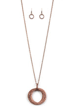 Load image into Gallery viewer, Featuring a hammered finish, a collection of interlocking copper hoops are threaded through the center of textured copper fittings. The dizzying pendant swings from the bottom of a lengthened copper chain for a dramatic industrial look. Features an adjustable clasp closure.  Sold as one individual necklace. Includes one pair of matching earrings.