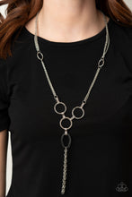 Load image into Gallery viewer, Hammered silver rings and ovals link into an industrial style pendant at the bottom of shimmery sections of silver chains. Classic silver chains stream from the bottom of the display, adding edgy movement. Features an adjustable clasp closure..  Sold as one individual necklace. Includes one pair of matching earrings.