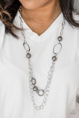 Dramatic gunmetal accents trickle along bold silver chains, creating an edgy mixed metallic palette across the chest. Features an adjustable clasp closure.  Sold as one individual necklace. Includes one pair of matching earrings.
