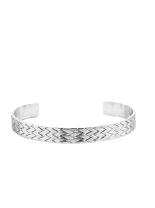 Embossed in braided metallic textures, an antiqued silver cuff curls around the wrist for a rustic finish.  Sold as one individual bracelet.  