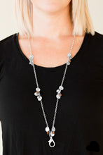 Load image into Gallery viewer, Delicately hammered in blinding shimmer, glittery silver discs join brown crystal-like beading along a shiny silver chain for a whimsical look. A lobster clasp hangs from the bottom of the design to allow a name badge or other item to be attached. Features an adjustable clasp closure.  Sold as one individual lanyard. Includes one pair of matching earrings.